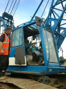 Five-year-old Russel Taylor enjoys the chance to sit in one of the cranes being used to revamp the Abbey Bridge.
