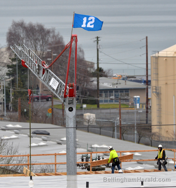 Dawson Construction crane flying 12th Man flag attached to a crane along 1000 block of Railroad Avenue on Tuesday, Jan. 7, 2014 in Bellingham. ANDY BRONSON â€” THE BELLINGHAM HERALD Read more here: http://www.thenewstribune.com/2014/01/08/2984058/12th-man-flag-flying-high-in-downtown.html#storylink=cpy