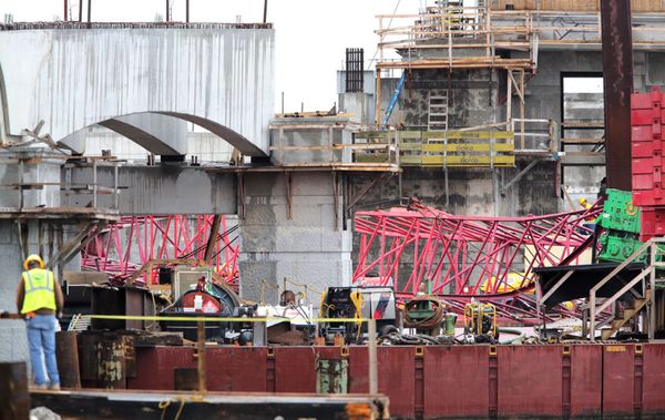 A section of a large crane that was working on the Flagler Bridge lies on a barge in the Intracoastal Waterway after it collapsed Wednesday morning, January 6, 2016. According to WPTV Chanel 5, West Palm Beach Fire Rescue said no one was injured and no fuel spilled when the crane fell onto a barge.  No traffic is being affected.