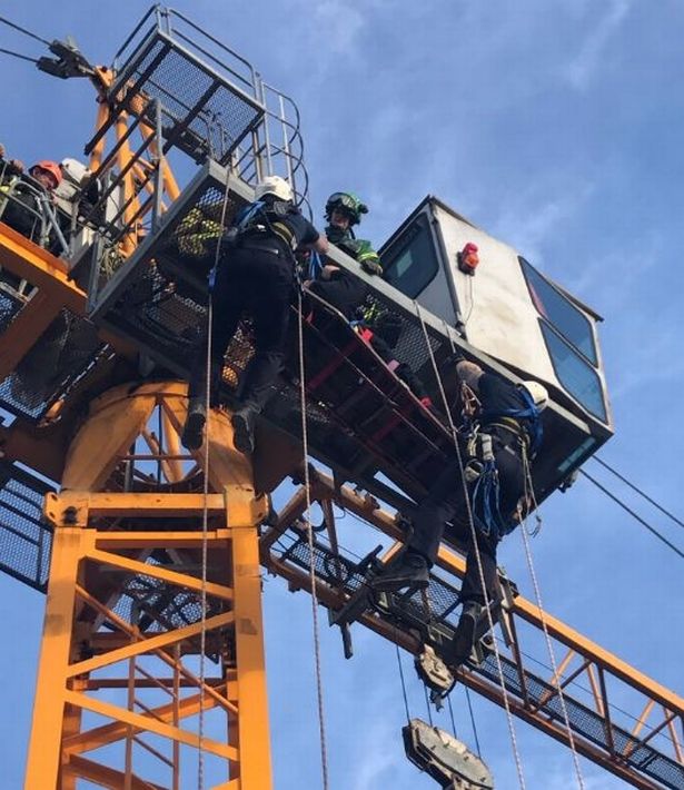Worker rescued from top of crane after becoming unwell